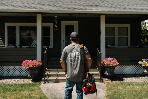 Nathan outside a house
